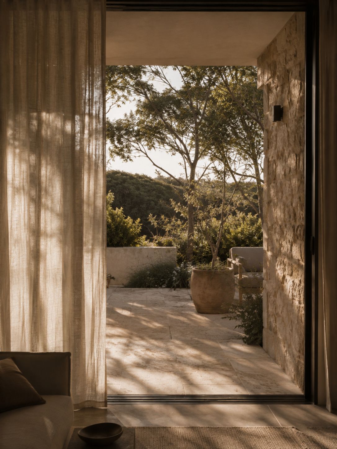 Light and courtyard flow through an open living space